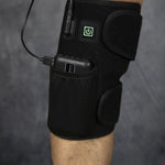 Red light therapy knee brace worn on knee - front view showing one-touch power button and elastic wrap fit